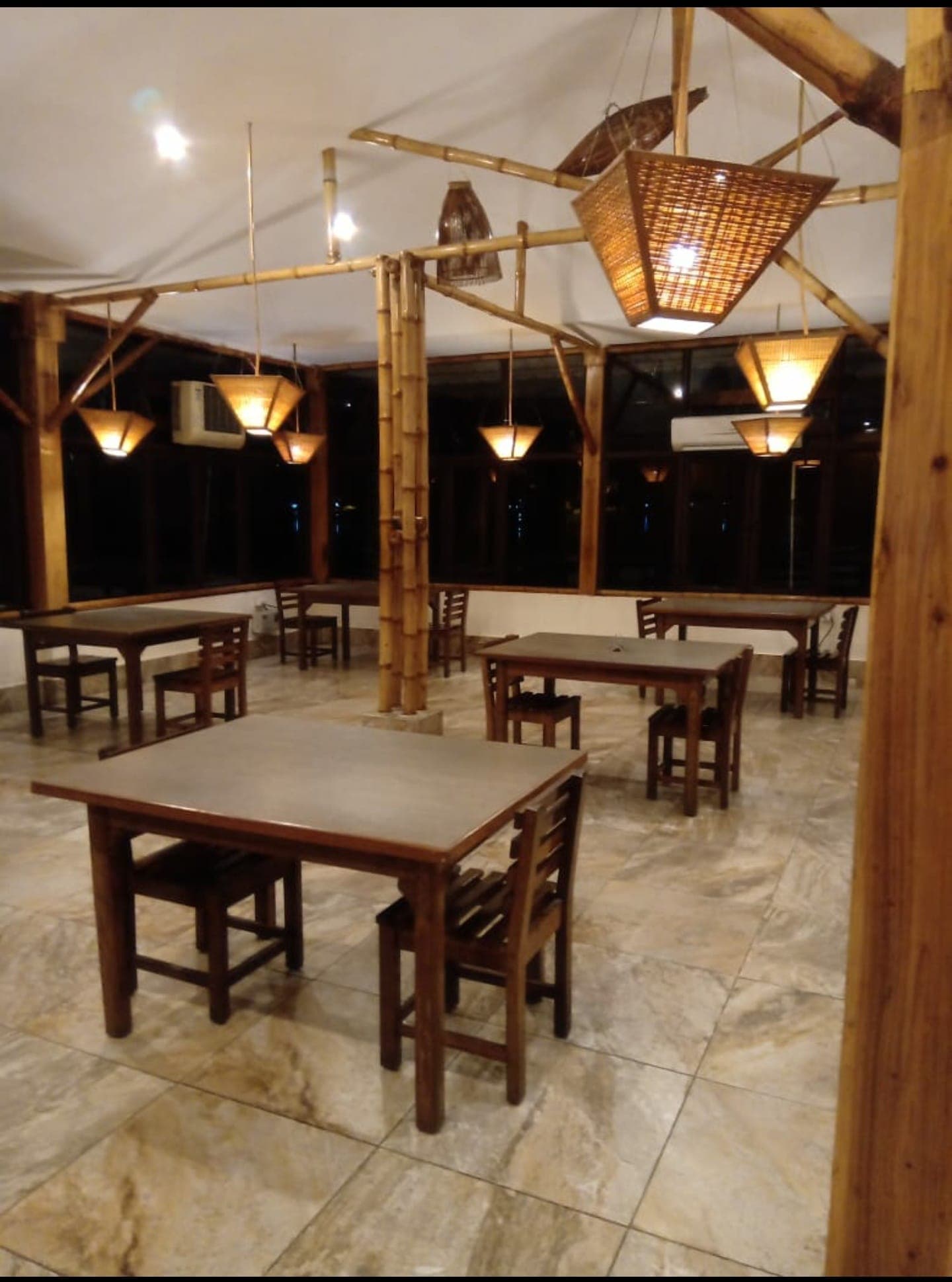 Heritage-inspired interior design showcasing intricate woodwork and comfortable seating.